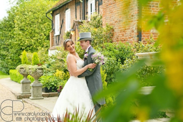 bride and groom by leaves