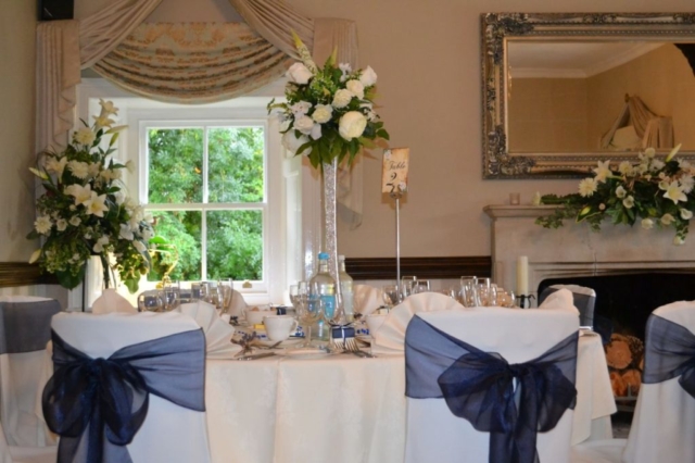 Newland Hall Table arrangement Blue Ribbons wedding venue essex