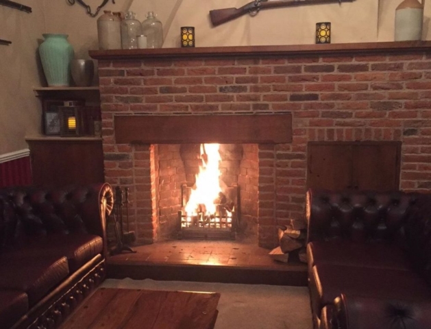 Fireplace in Armoury Room at Newland Hall wedding venue essex