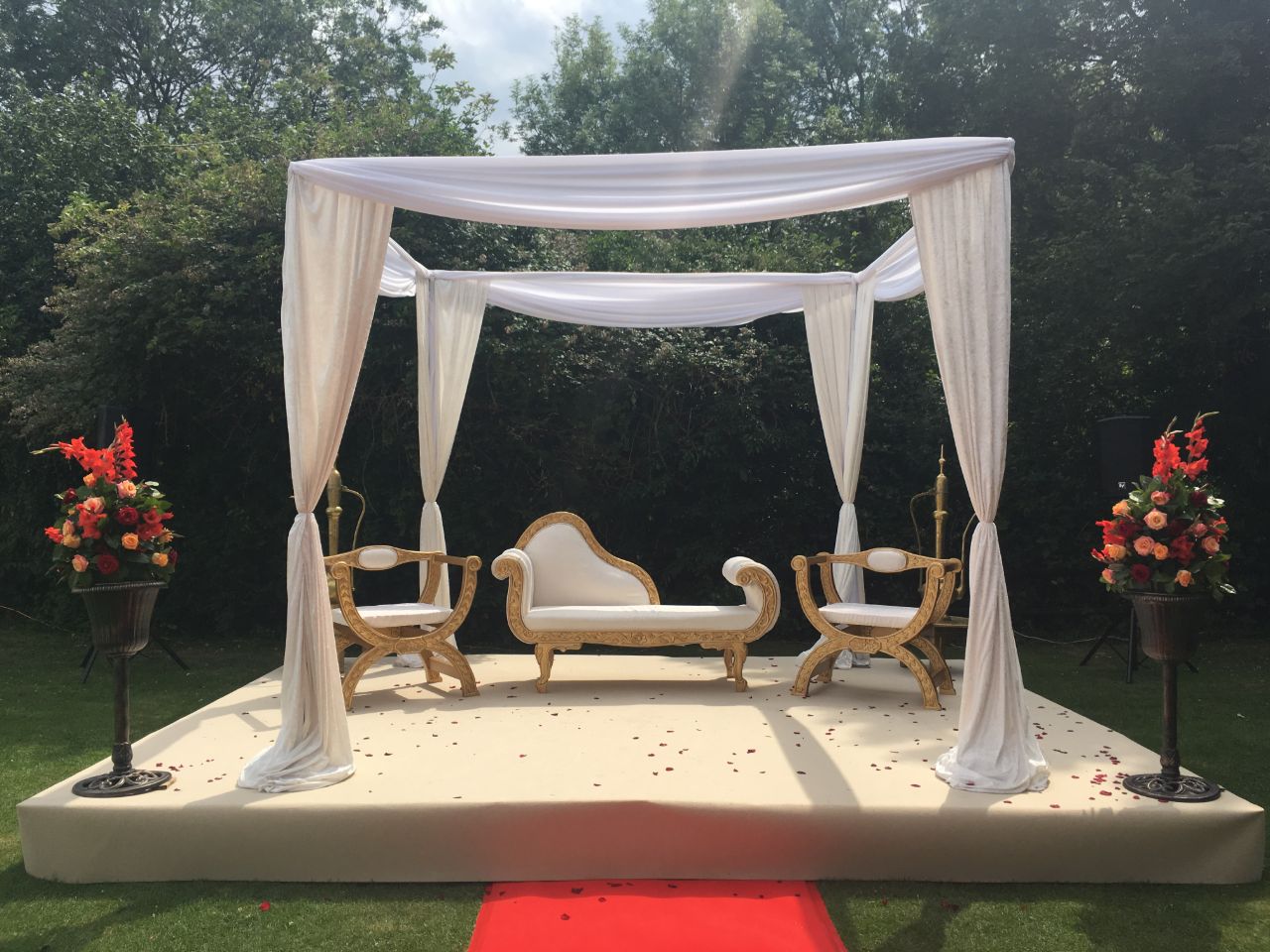 Seating area at end of red carpet wedding venue essex