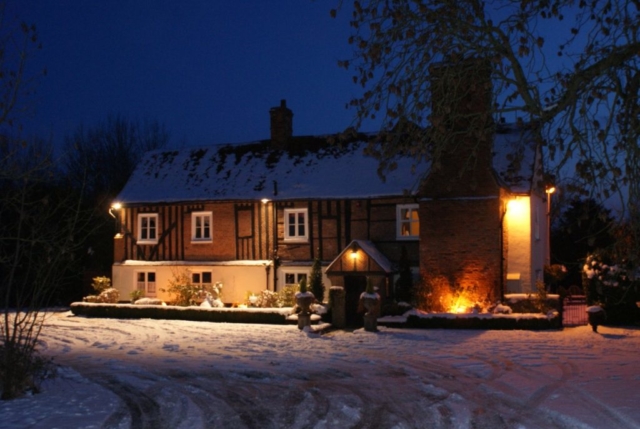 Newland Hall main building covered with snow wedding venue essex