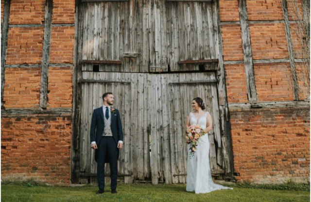 Bride and Groom outside of Barn Door