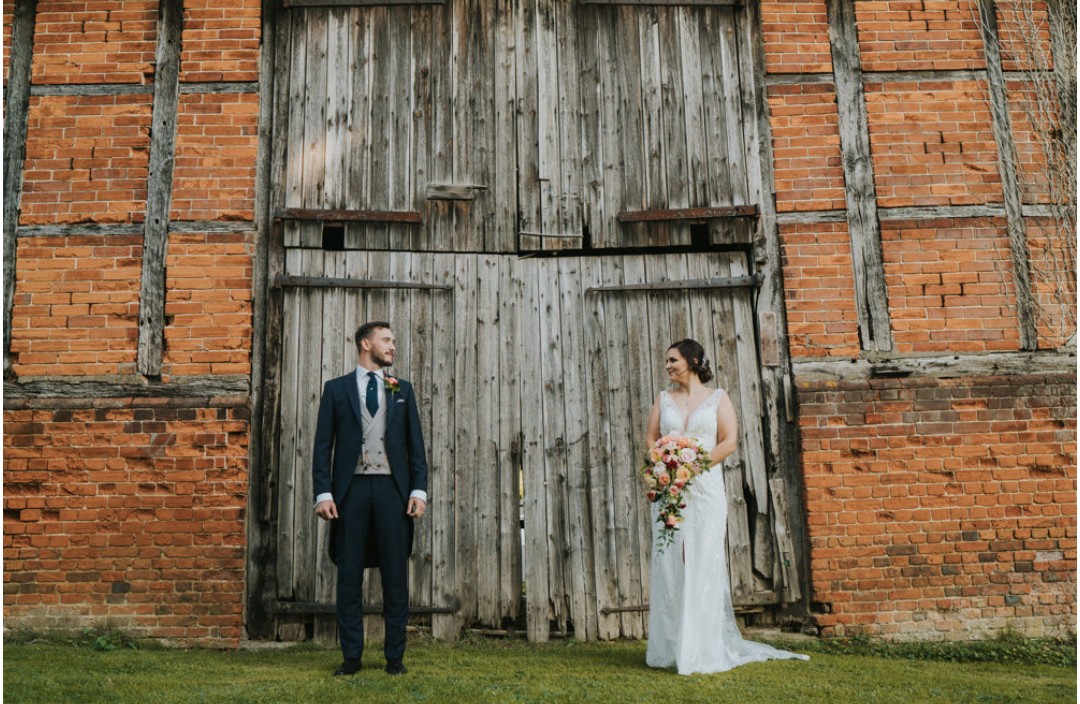 Bride and Groom outside of Barn Door