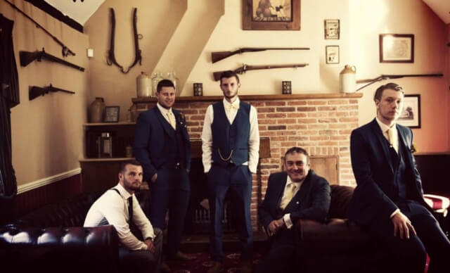 Groomsmen in hunting room