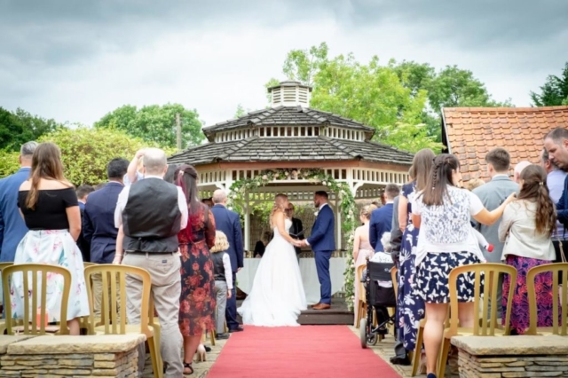 Gazebo ceremony on sunny day wedding venue essex