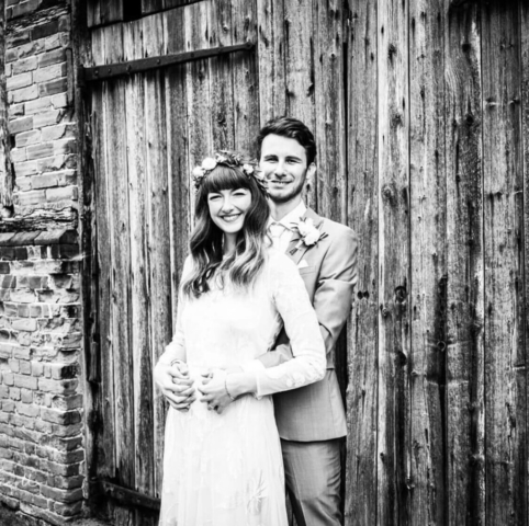 Bride and Groom outside of Barn Door