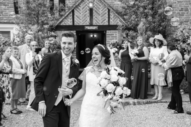 bride and groom laughing bubbles